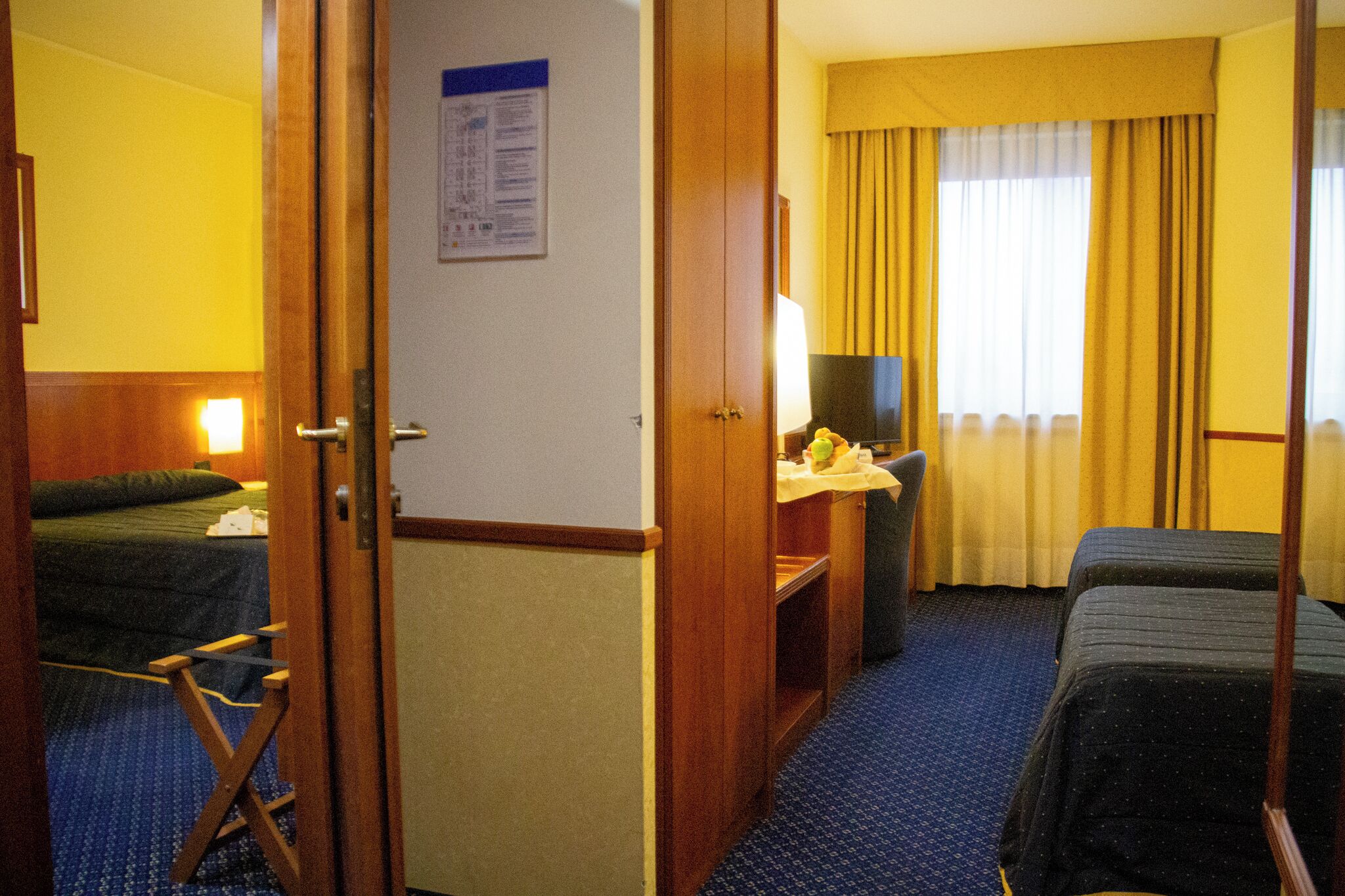 Family Room | Minibar, in-room safe, free WiFi, bed sheets