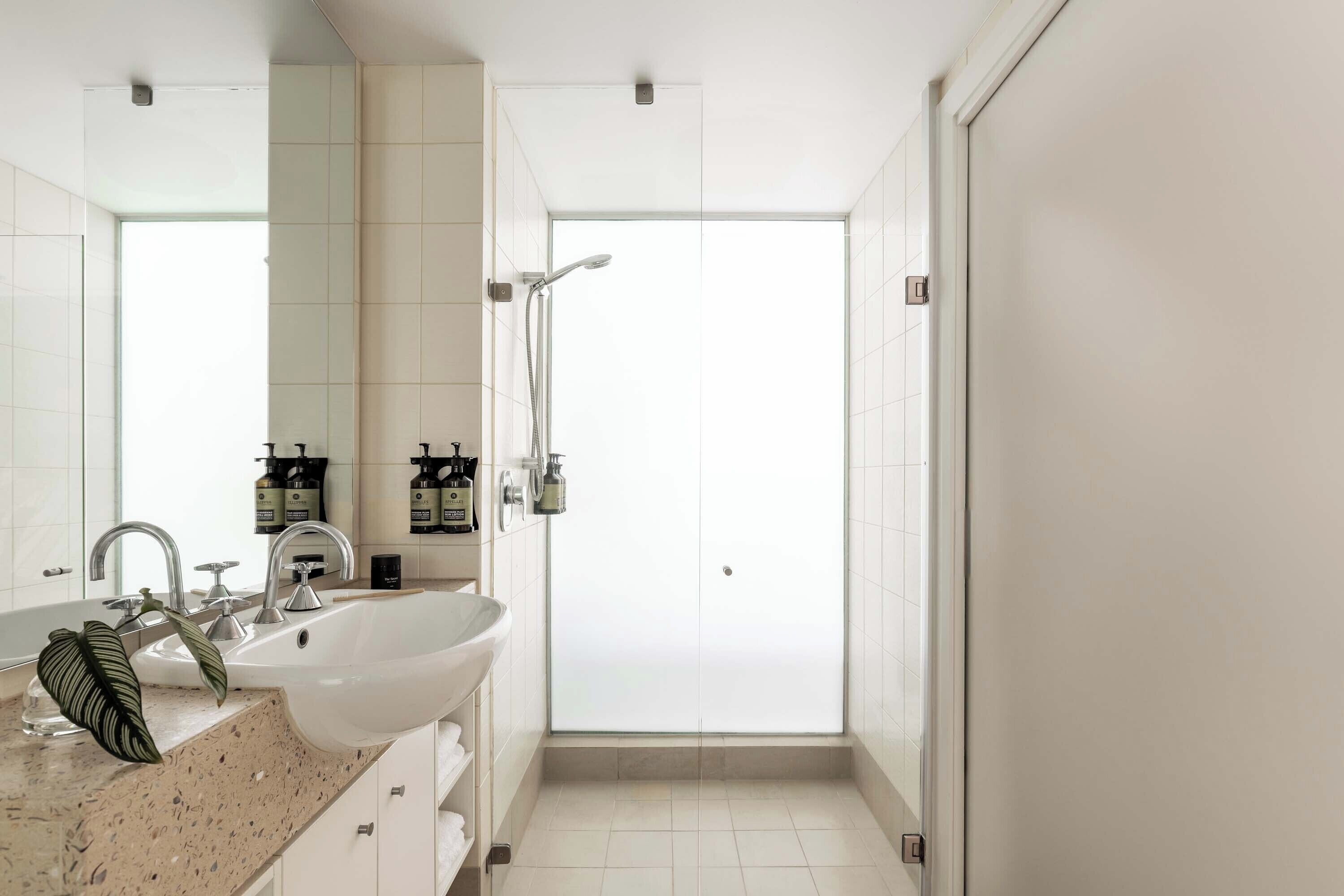 shower, hair dryer, bathrobes, towels