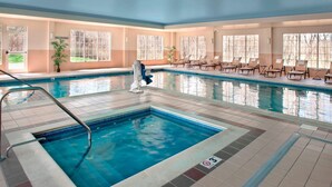 An indoor swimming pool with a diving board, lounge chairs, and a 'No Diving' sign. - Fairfield Inn & Suites by Marriott Great Barrington Lenox/Berkshires (Great Barrington)
