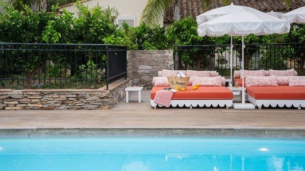 Outdoor pool, pool umbrellas, pool loungers