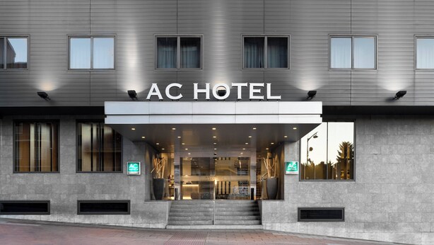 The exterior of the AC Hotel with a modern facade, large windows, and a prominent entrance. - AC Hotel Ponferrada by Marriott (Ponferrada)
