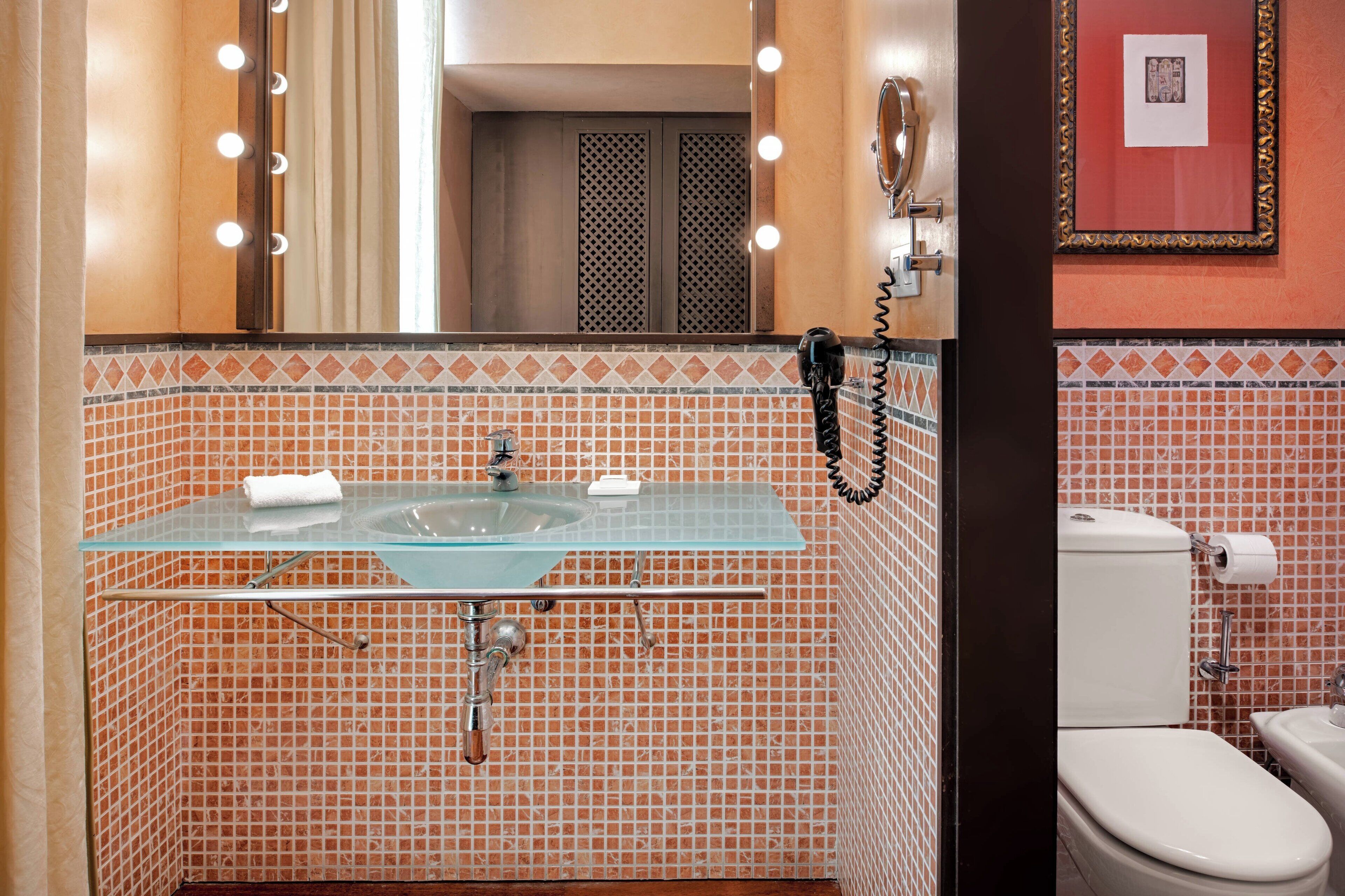 free toiletries, hair dryer, bidet, towels