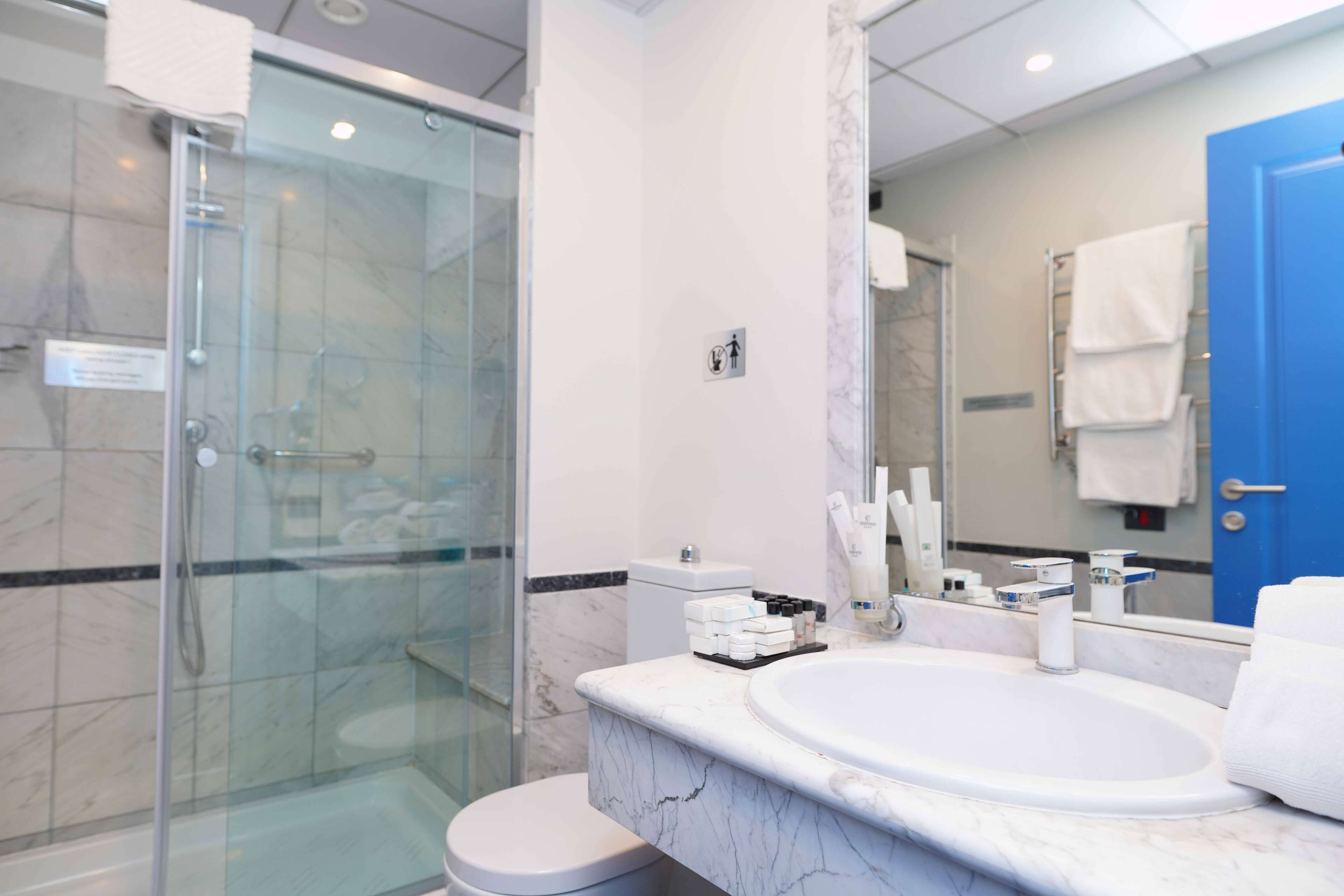 superior room, 1 king bed, non smoking | bathroom | shower, free toiletries, hair dryer, slippers