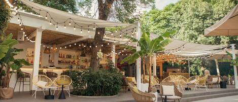 Seasonal outdoor pool, open 10:00 AM to 9:00 PM, pool umbrellas