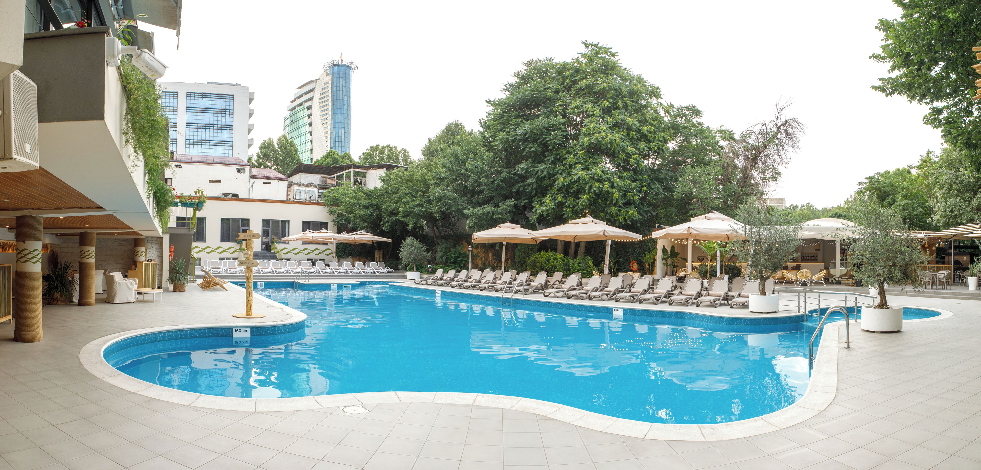 seasonal outdoor pool, open 10:00 am to 9:00 pm, pool umbrellas