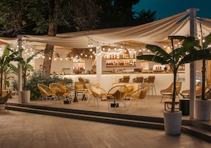 Seasonal outdoor pool, open 10:00 AM to 9:00 PM, pool umbrellas