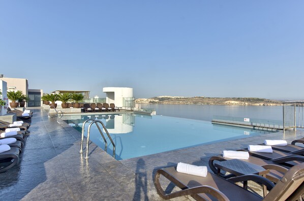 Indoor pool, outdoor pool, pool umbrellas