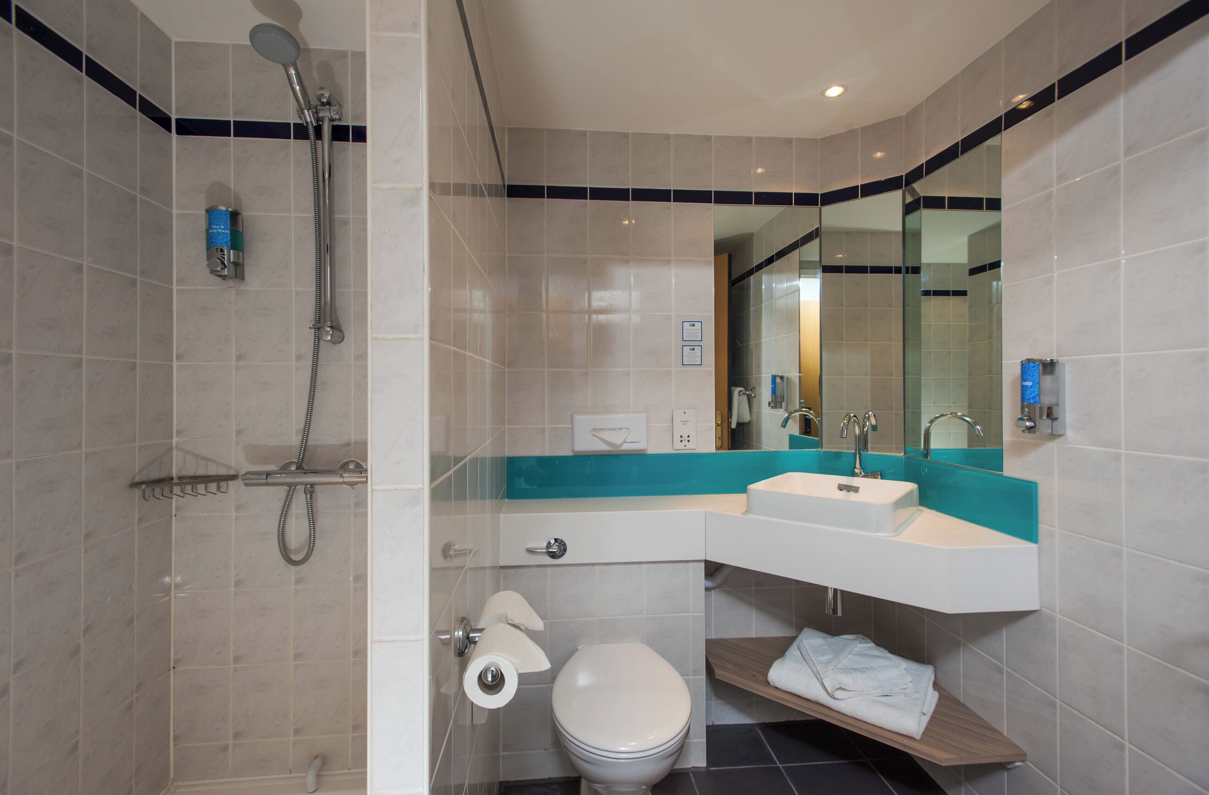 Shower, eco-friendly toiletries, hair dryer, towels