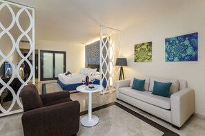 Privilege Junior Suite Adults Only | Minibar, in-room safe, desk, blackout drapes