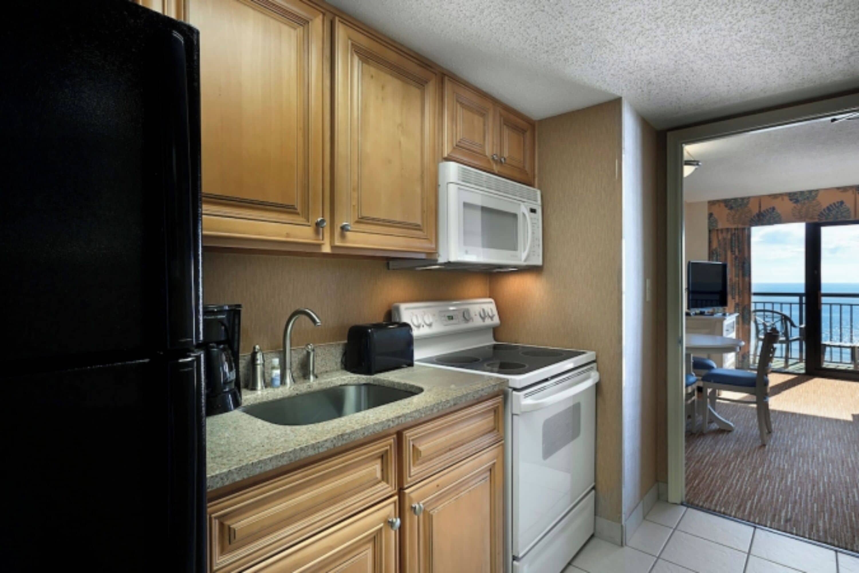 Paradise Oceanfront Standard One Bedroom Queen Suite | Private kitchen | Coffee/tea maker, cookware/dishes/utensils
