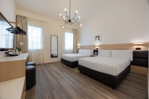Family Room | Premium bedding, down comforters, in-room safe, desk