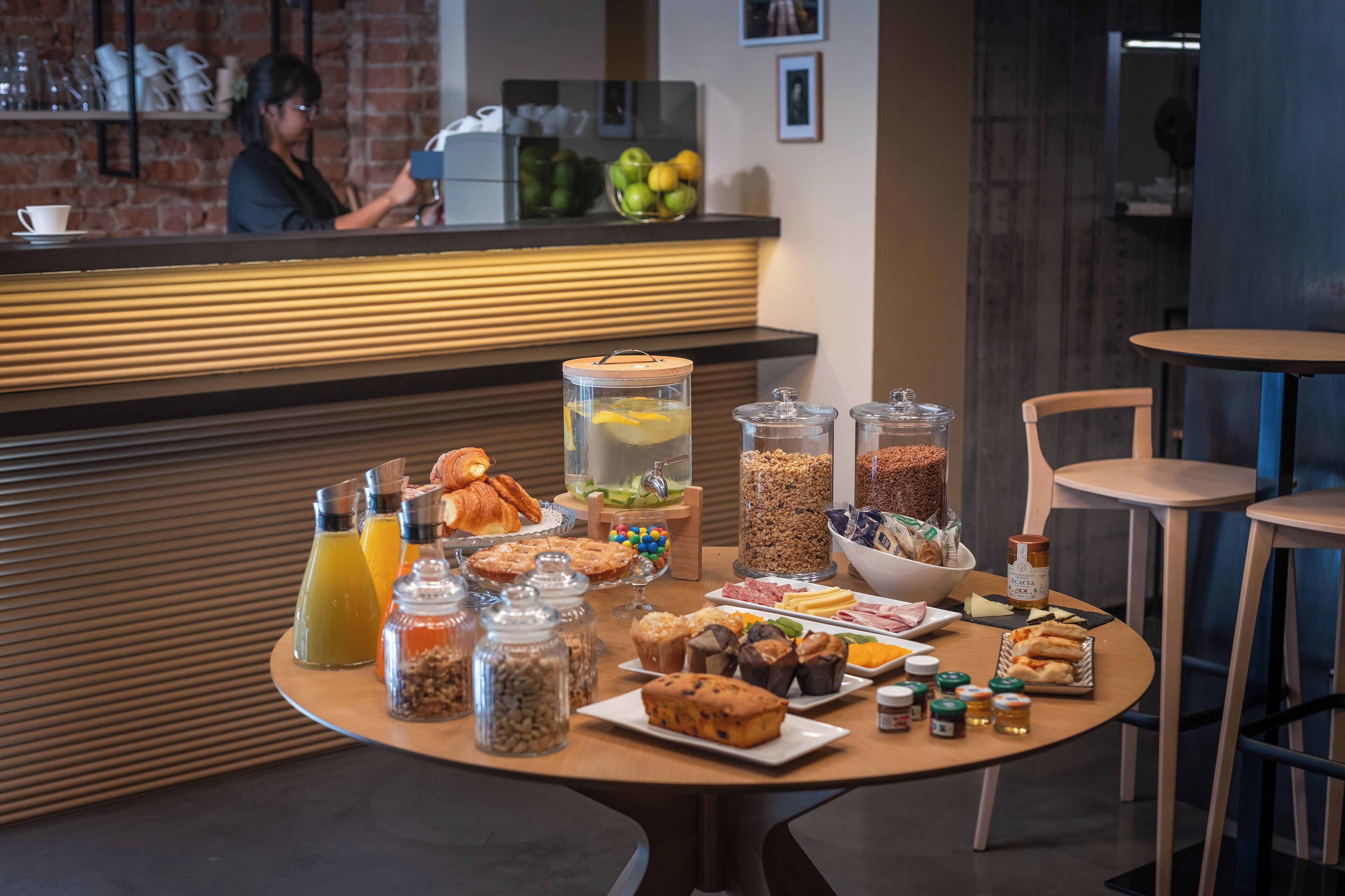 A breakfast buffet with various food items and beverages.
