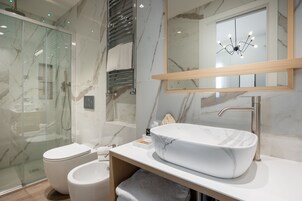 Eco-friendly toiletries, hair dryer, slippers, towels