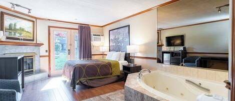 Suite, 1 King Bed, Non Smoking | Desk, laptop workspace, blackout drapes, iron/ironing board