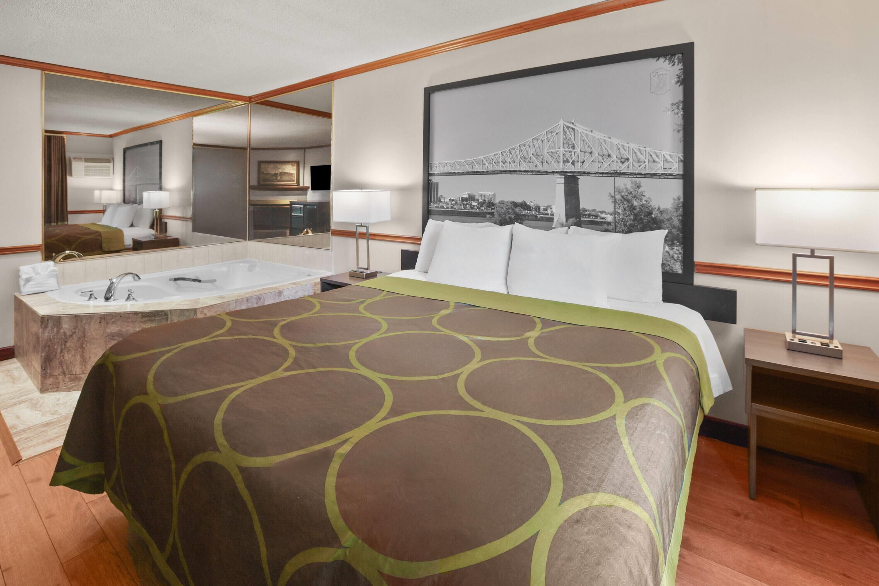 Suite, 1 King Bed, Non Smoking | Desk, laptop workspace, blackout drapes, iron/ironing board