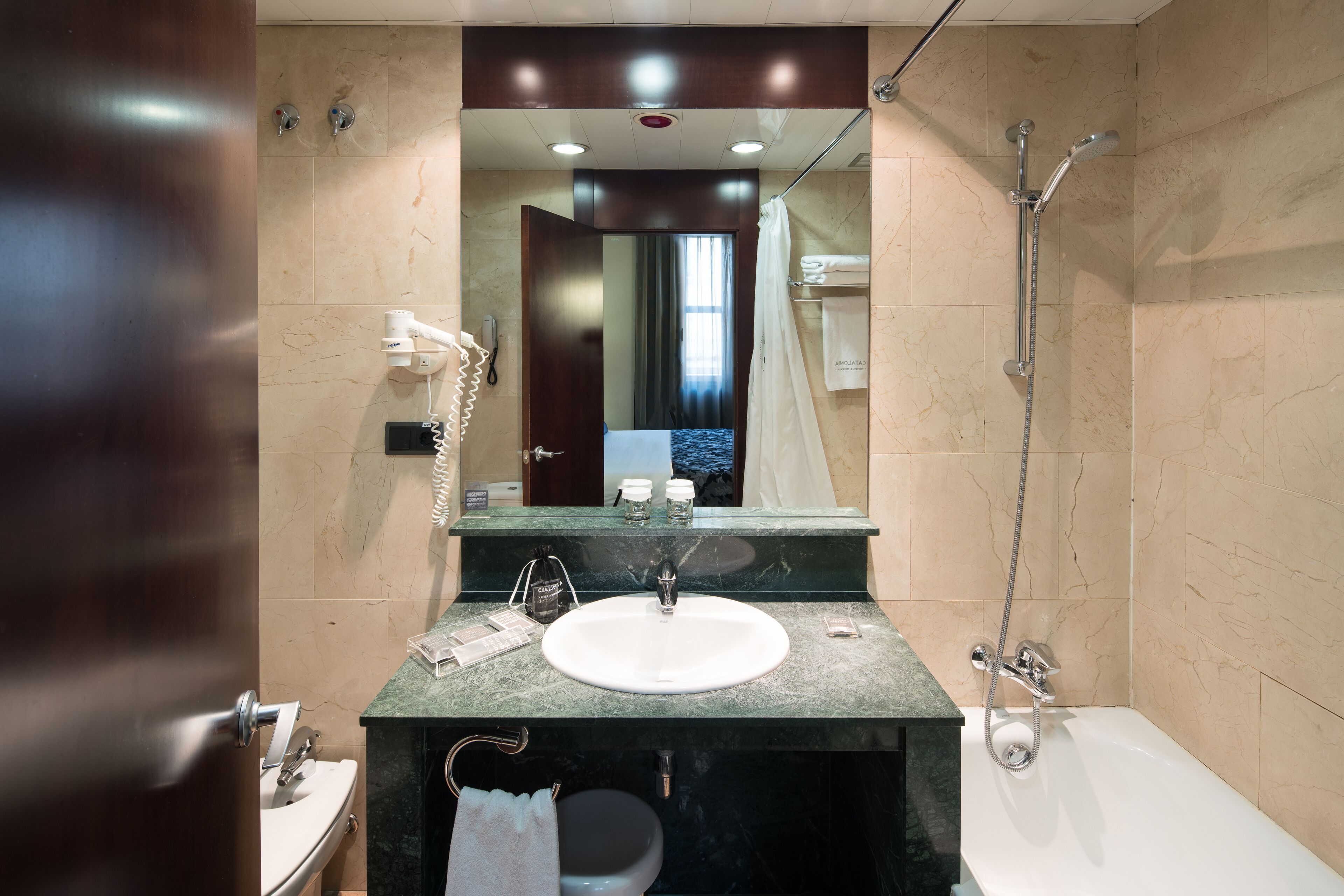 eco-friendly toiletries, hair dryer, towels