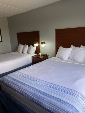 Blackout drapes, iron/ironing board, free cribs/infant beds