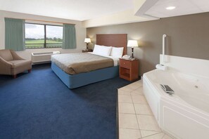 Suite, 1 King Bed (One-Bedroom Suite) | Blackout drapes, iron/ironing board, free cribs/infant beds