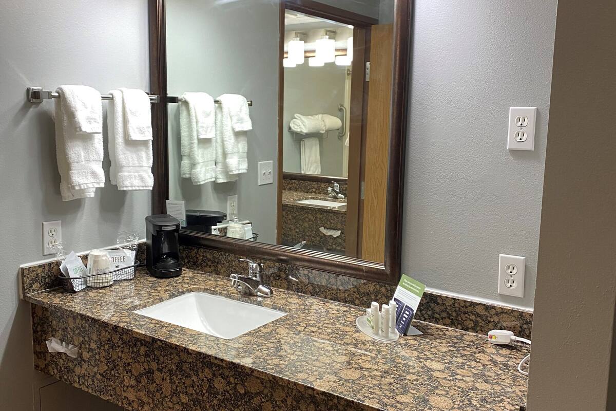 studio suite, 1 king bed | bathroom | free toiletries, hair dryer, towels