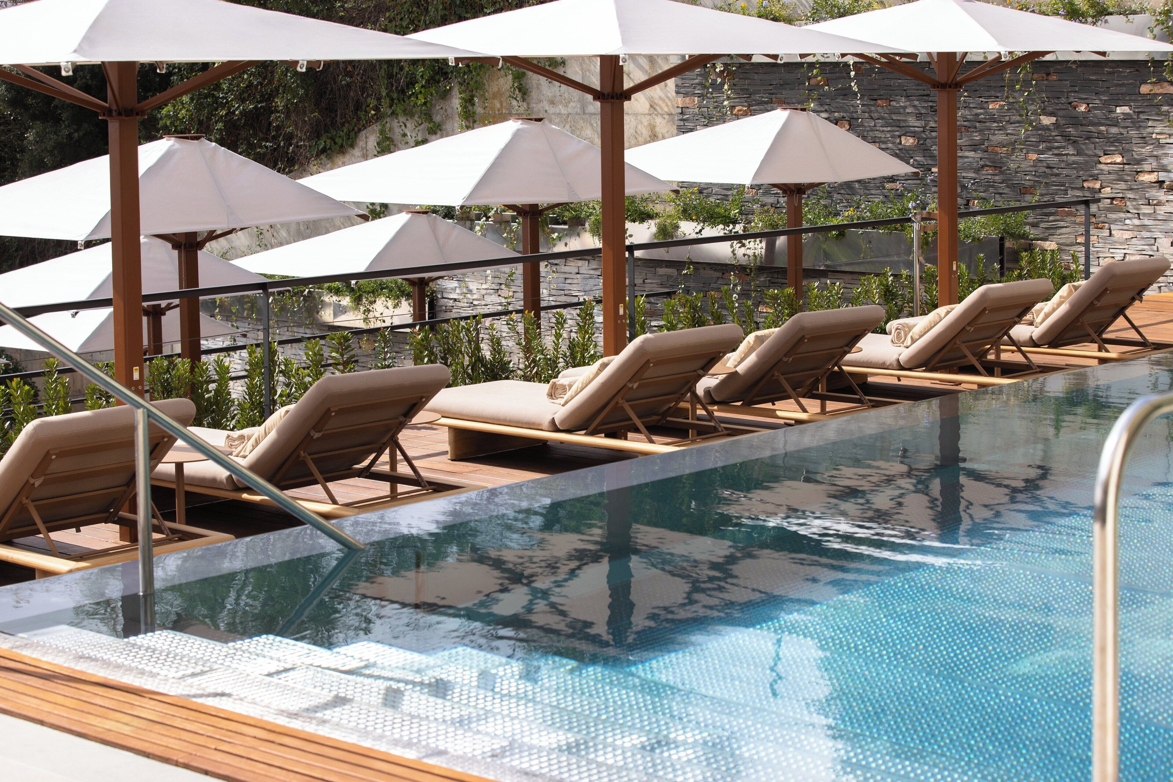 indoor pool, outdoor pool, pool umbrellas