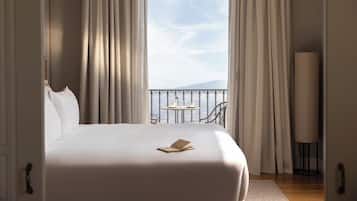 Ropa de cama de alta calidad, edredones de plumas, minibar y caja fuerte