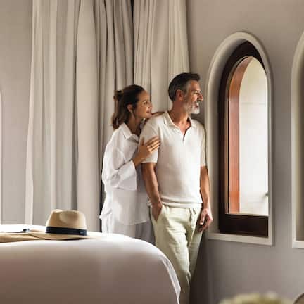 Premium bedding, down comforters, minibar, in-room safe