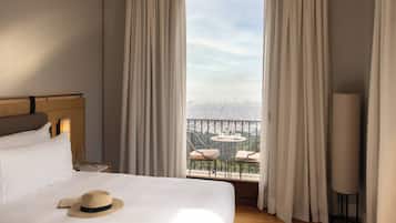 Premium bedding, down comforters, minibar, in-room safe