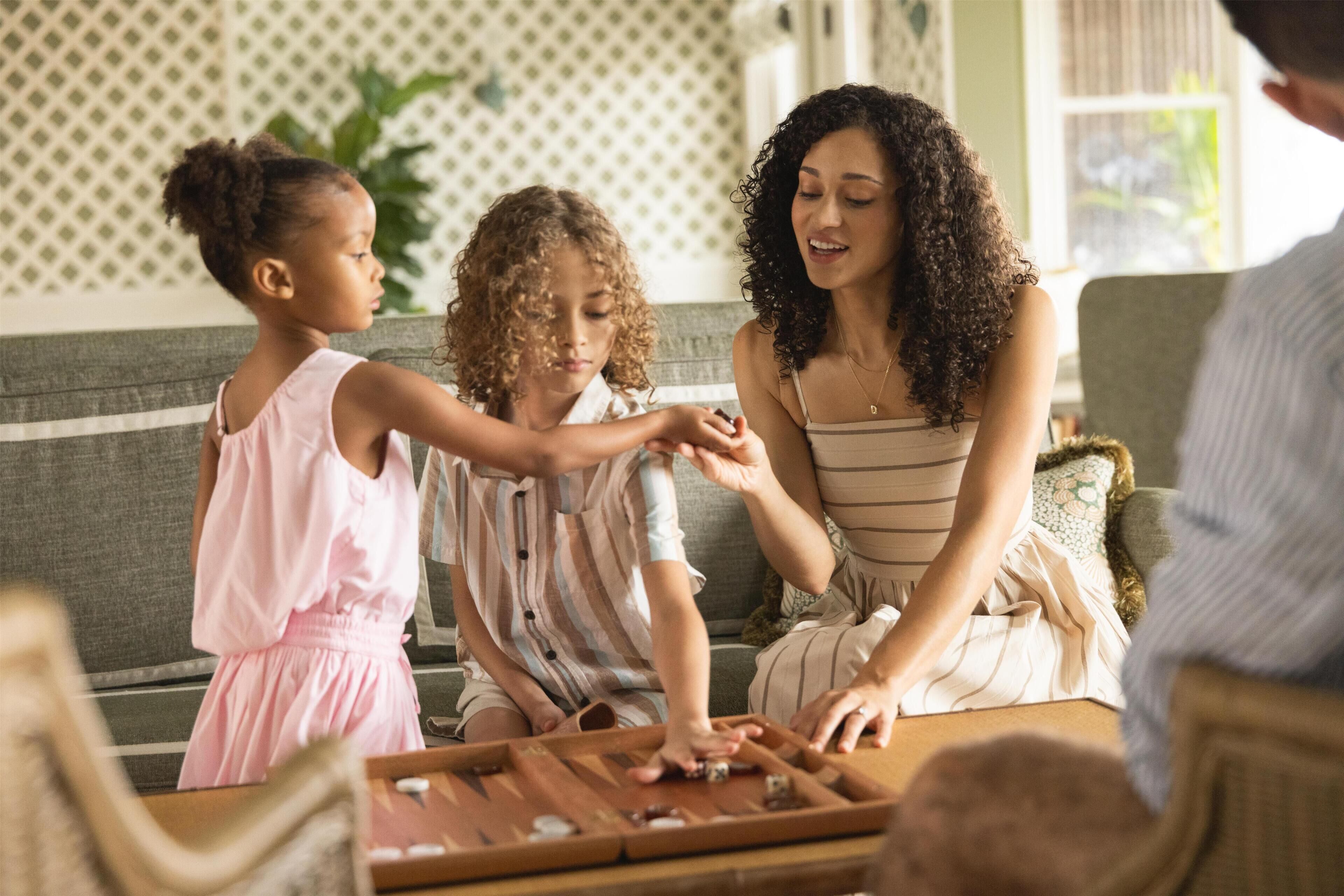 A family playing a board game at home.