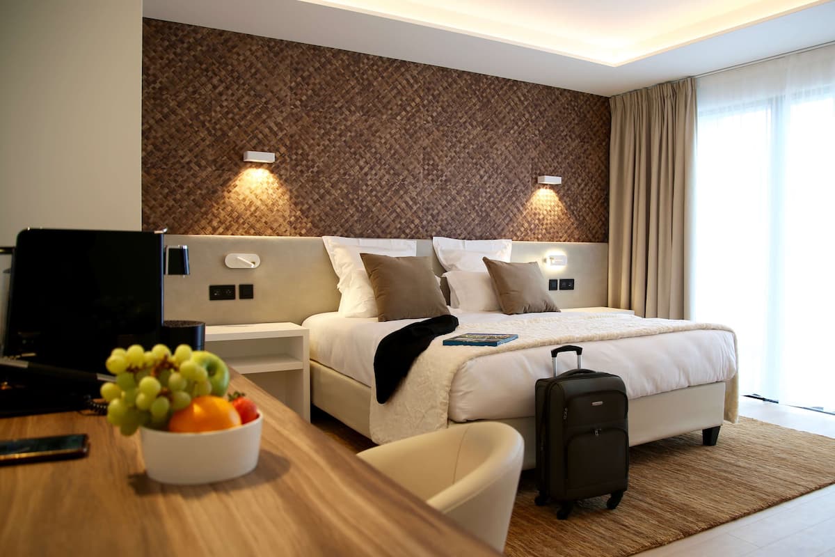 exclusive double room, 1 king bed, golf view (terrace) | 1 bedroom, premium bedding, minibar, in-room safe