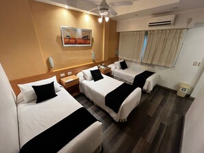 Standard Triple Room | 1 bedroom, down comforters, pillowtop beds, in-room safe