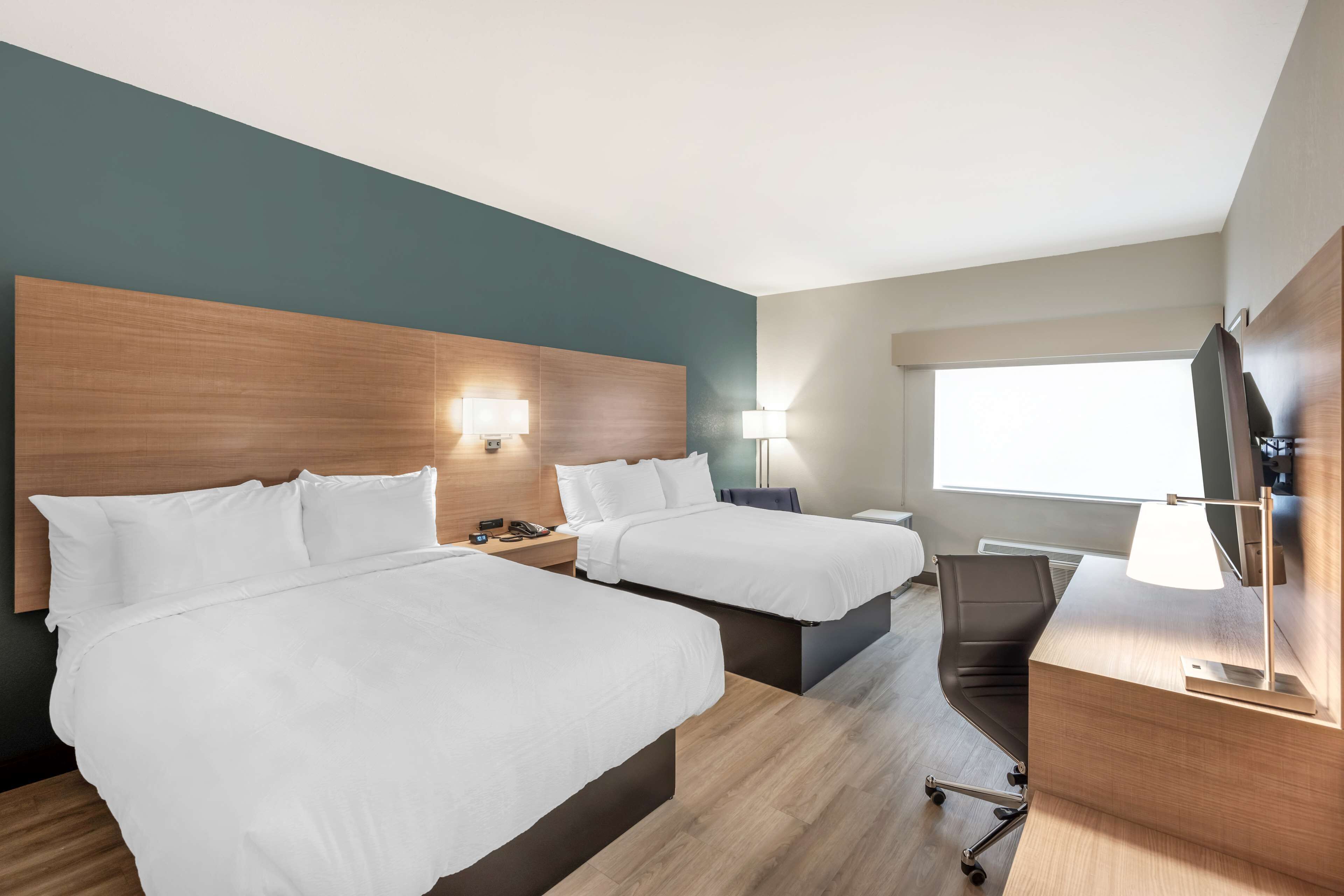 standard room, 2 queen beds, non smoking, refrigerator & microwave (walk-in shower) | hypo-allergenic bedding, desk, iron/ironing board, wifi