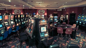 A casino with multiple slot machines and a few tables. - Coco Beach Hotel (Sardinal)