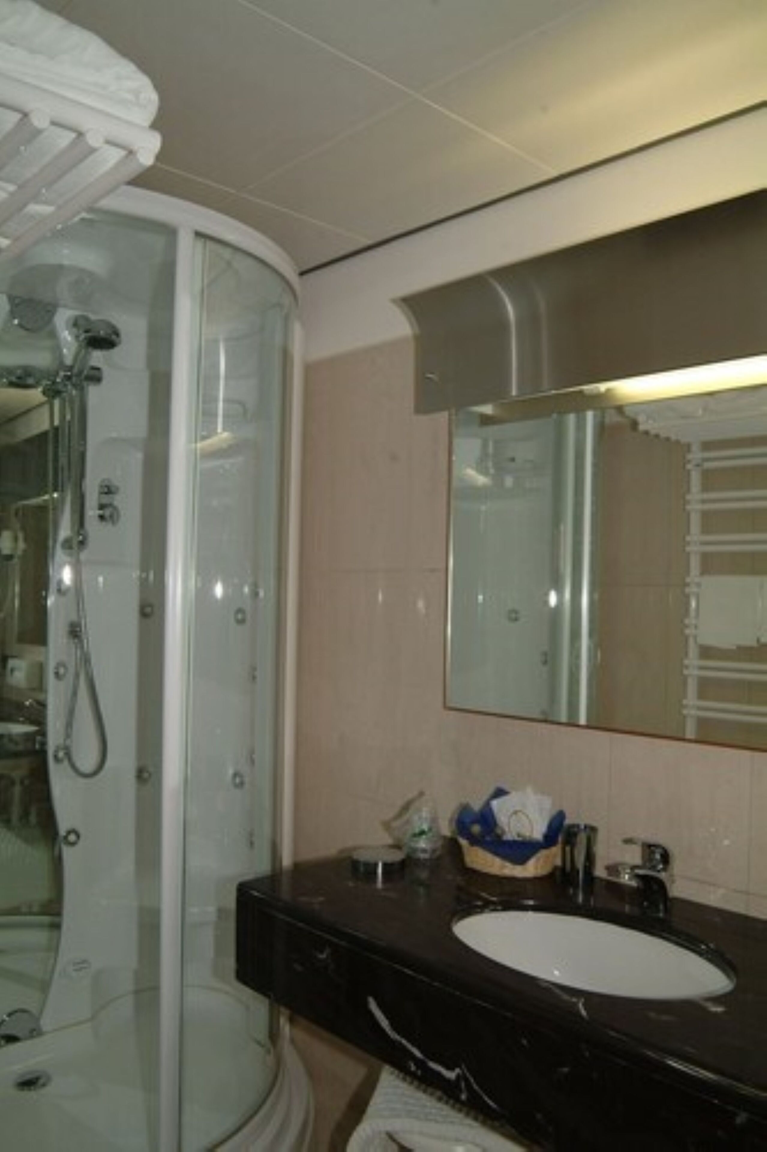 hair dryer, slippers, bidet, towels