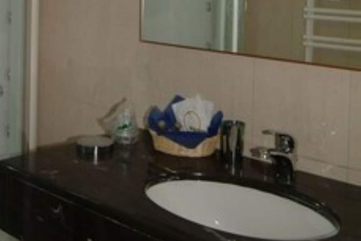 hair dryer, slippers, bidet, towels