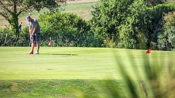 Enjoy a serene golfing experience on our well-maintained course surrounded by lush greenery.
