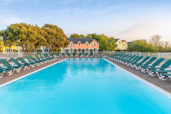 Seasonal outdoor pool, pool umbrellas, pool loungers