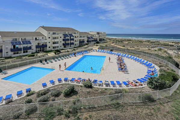 Seasonal outdoor pool, pool loungers