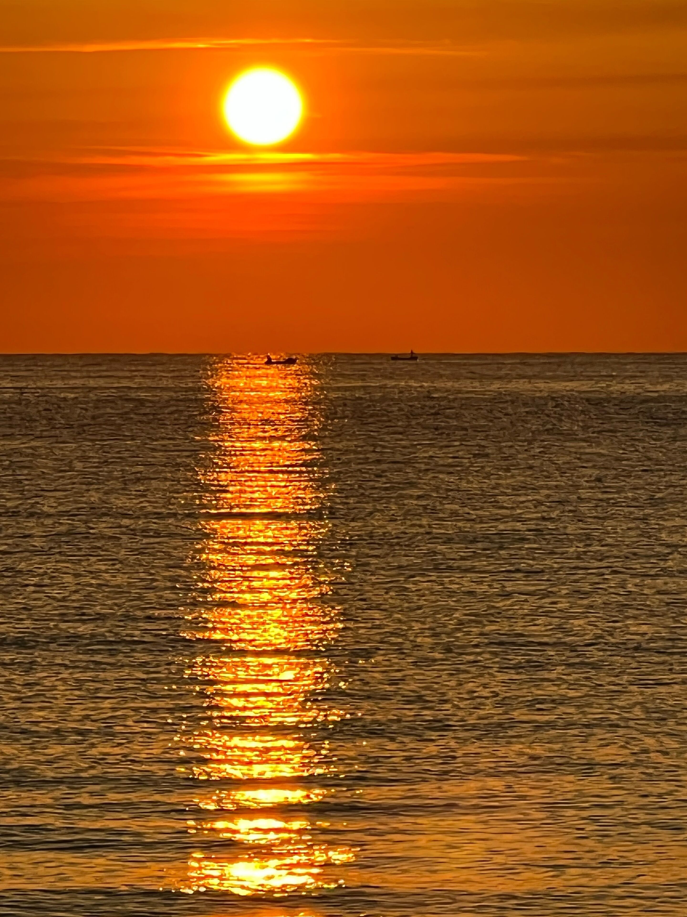 on the beach, sun-loungers, beach umbrellas, waterskiing