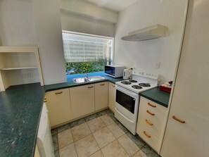 Fridge, microwave, electric kettle, cookware/dishes/utensils
