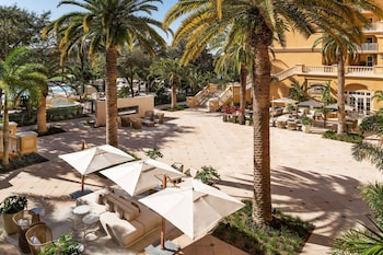 Outdoor pool, cabanas (surcharge), pool umbrellas at The Ritz-Carlton Orlando, Grande Lakes