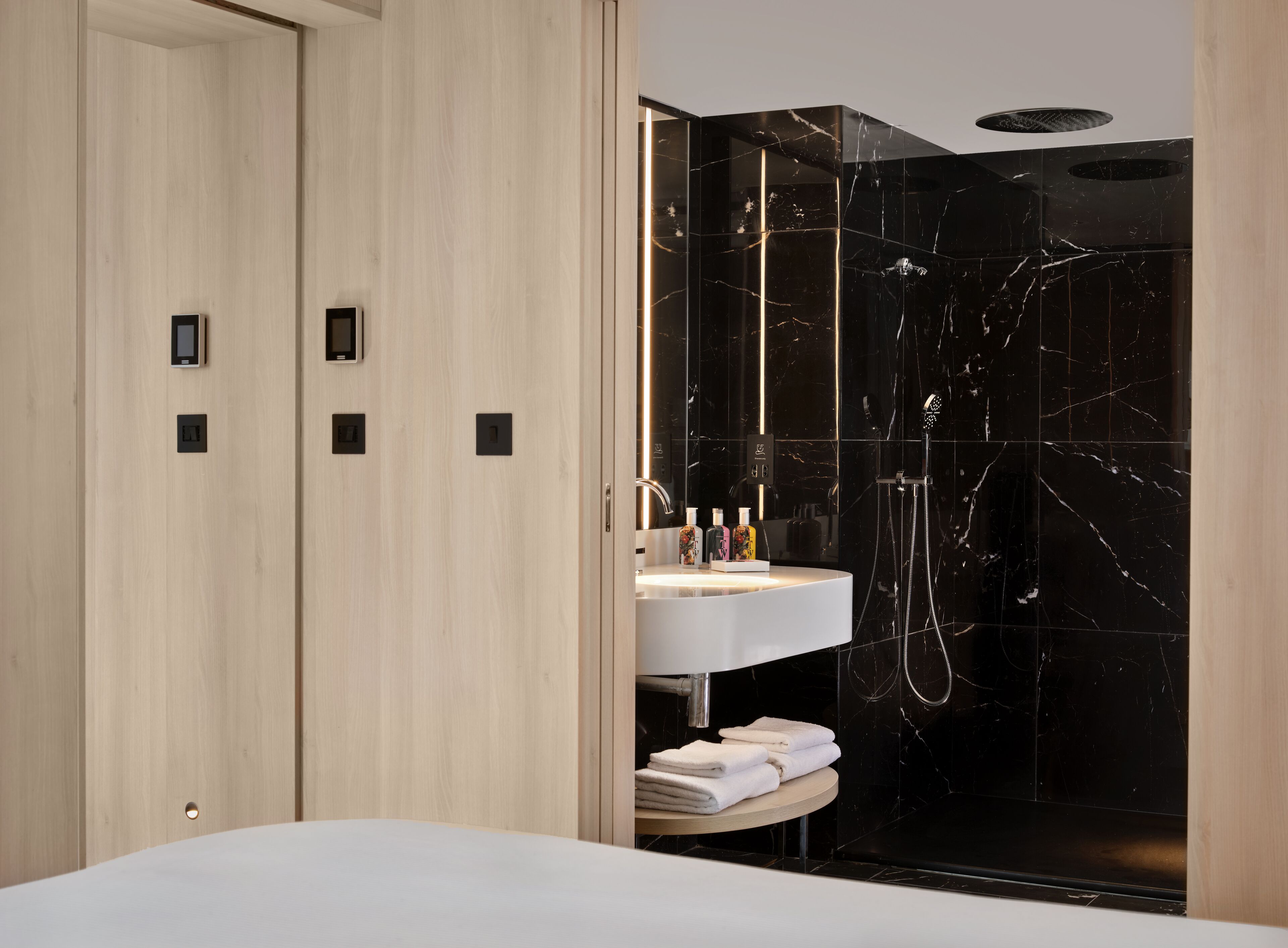 Designer toiletries, hair dryer, towels, soap