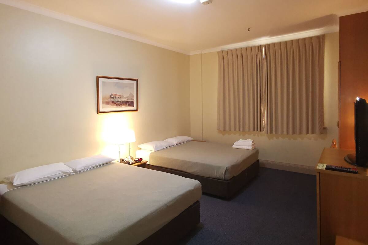 Quadruple Room | In-room safe, desk, iron/ironing board (on request), bed sheets