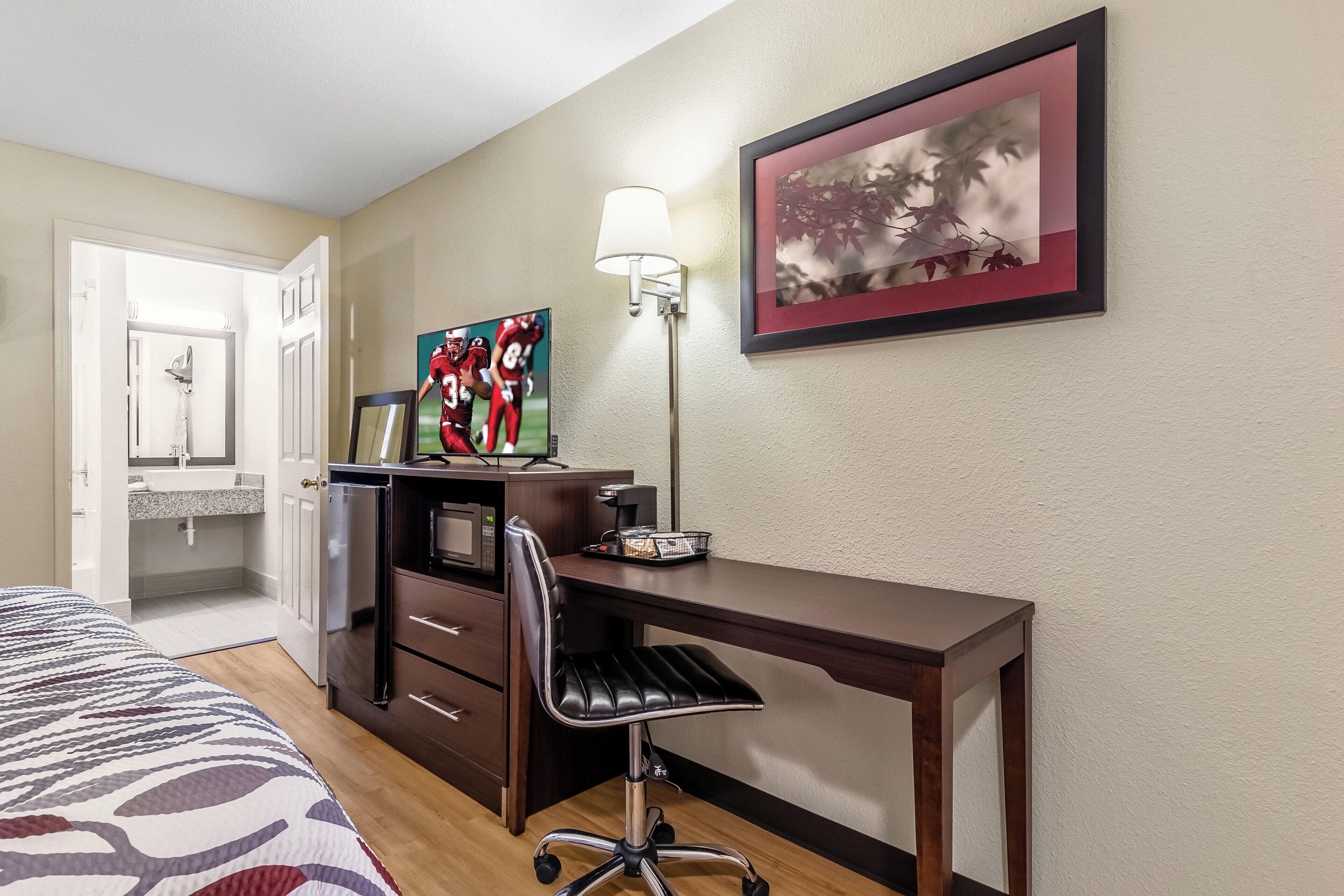 Desk, laptop workspace, blackout drapes, iron/ironing board