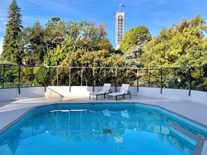 Seasonal outdoor pool, open 6:00 AM to 9:30 PM, pool umbrellas