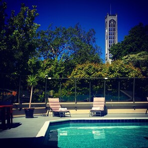 Seasonal outdoor pool, open 6:00 AM to 9:30 PM, pool umbrellas
