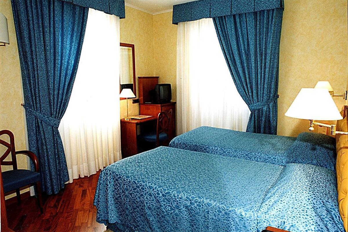 Superior Twin Room | Minibar, in-room safe, desk, laptop workspace