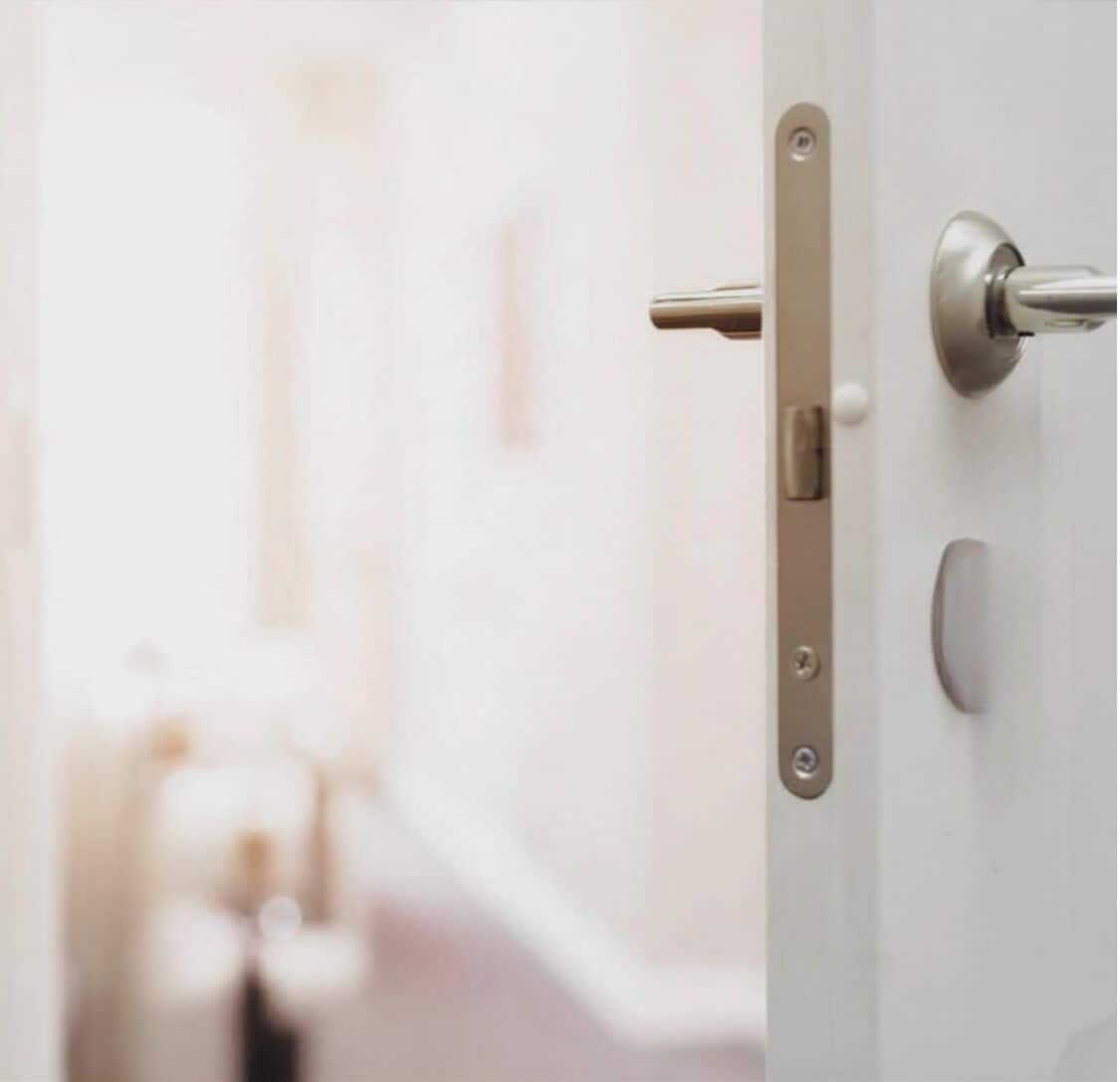 A door with a modern handle and a lock mechanism.