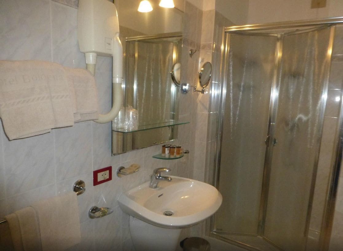 shower, hair dryer, slippers, bidet