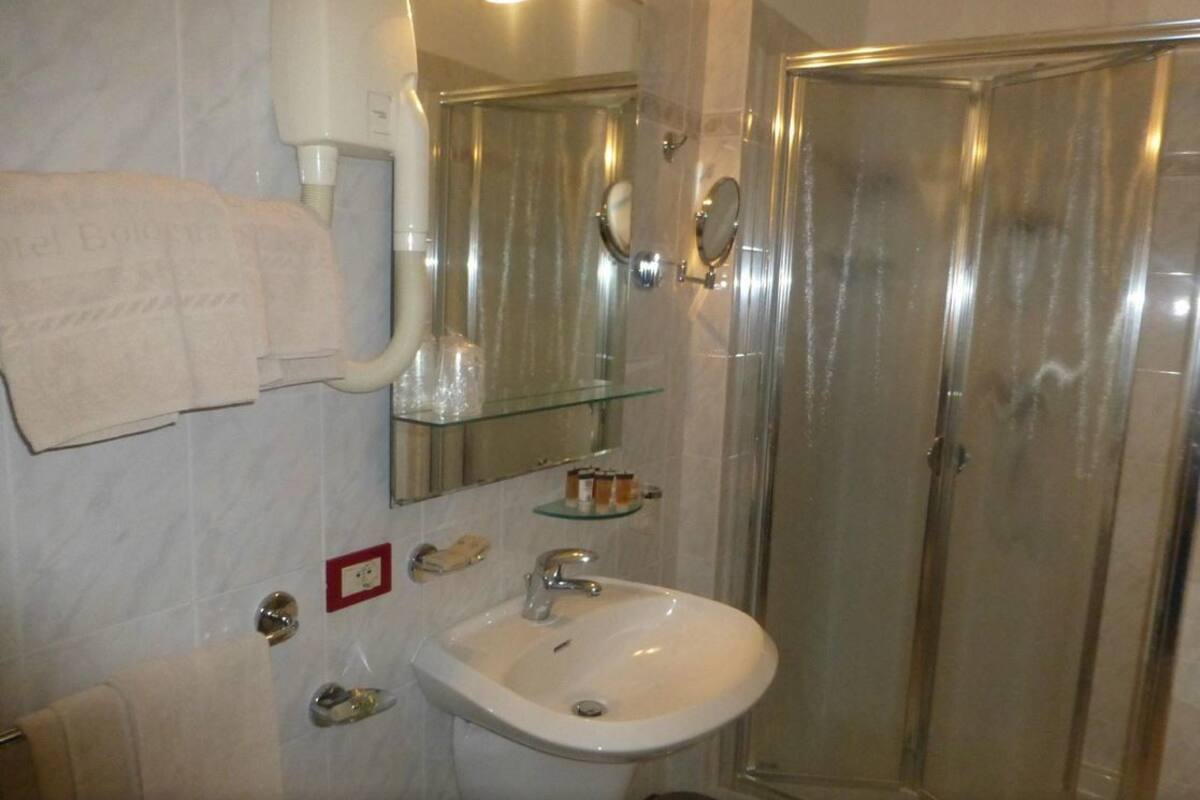 shower, hair dryer, slippers, bidet
