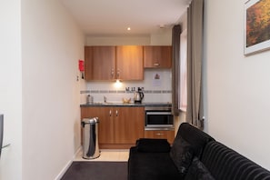Double Apartment | Living area | Flat-screen TV